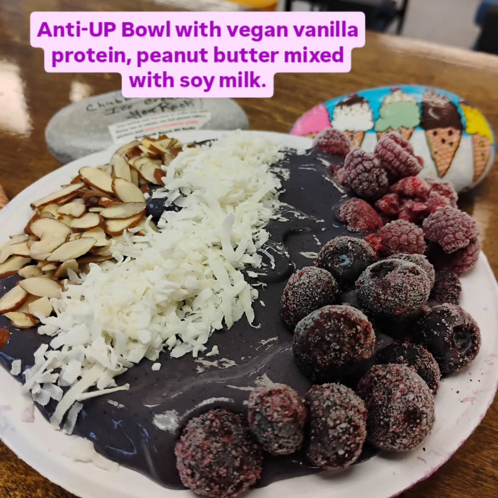 A smoothie bowl topped with fresh fruit