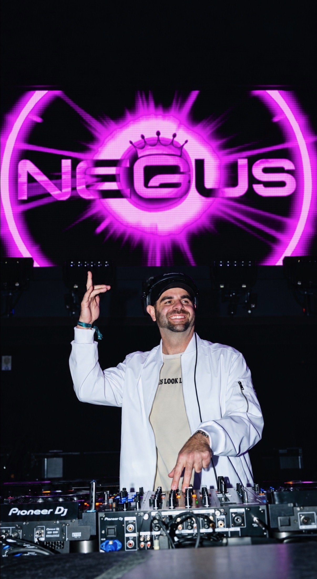 Negus behind the decks, stage lights